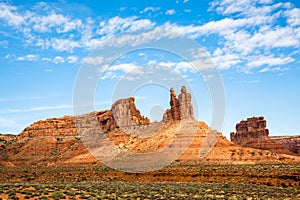 Spotlight sun through clouds of Southern Utah on red rock towers