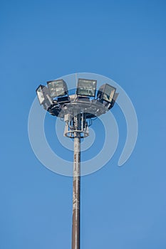 Spotlight surrounded with blue sky background.