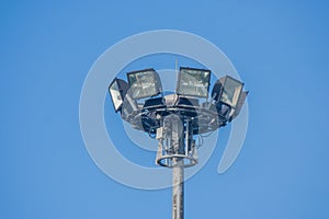 Spotlight surrounded with blue sky background.