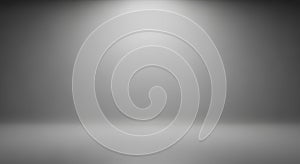 Spotlight on a textured gray studio background