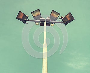 Spotlight tower with blue sky. The stadium light tower