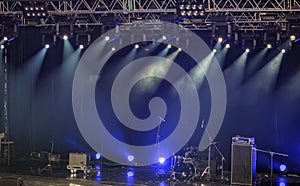 Spotlights and illumination on stage with sound equipment