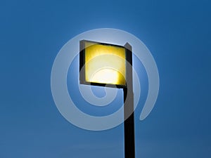 Spotlights tower with blue sky background.