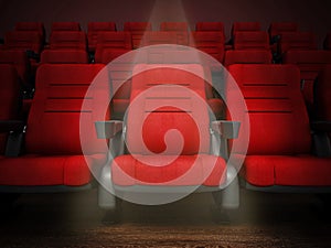 Spotlit red cinema chair in the first row. 3D illustration