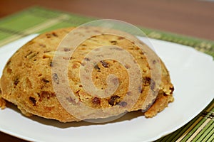 Spotted is a British pudding, made with suet and dried fruit, usually currants and raisins photo