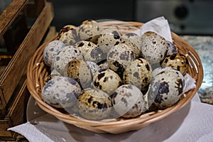 spotted quail eggs in a basket,spotted