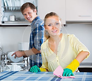 Spouses doing regular housework and polishing