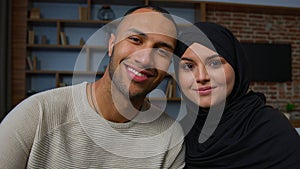 Spouses family multiracial diverse ethnicity couple man african american husband and arabian muslim woman wife smiling