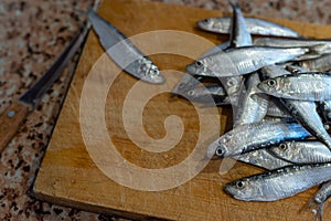 Sprat fish on a cutting board