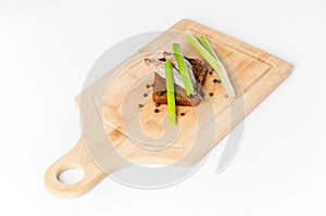 Sprat fish on cutting board