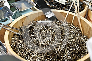 Sprat fish in a wooden cask on sale at japanese market