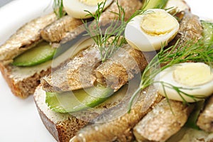 Sprats on bread photo