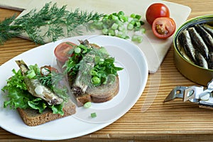 Sprats, bread, onion and tomatoes