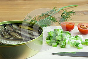 Sprats, onion and tomatoes