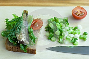 Sprats, onion and tomatoes