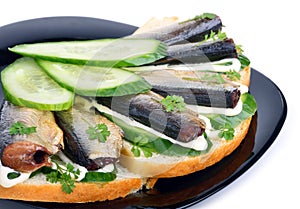 Sprats sandwiches, appetizer on plate