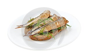 Sprats sandwiches on a plate