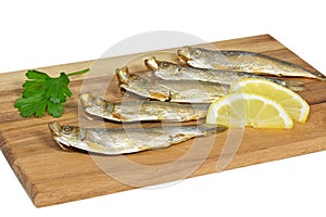 Sprats on a wooden board