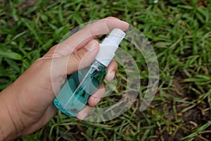 Spray alcohol female hands hand sanitizer gel to patient eliminate germs covid 19 prevention concept