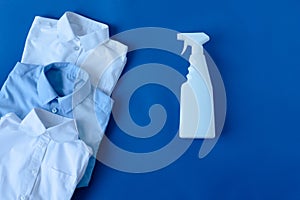 spray bleach clothes on a blue background