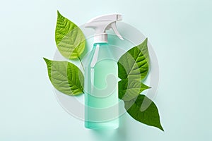 Spray bottle with cleaning product and green leaves around. Eco cleaning concept. Environmentally friendly bio natural cleaning