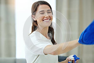 Spray bottle, cleaning window and woman with smile for hygiene, housework and chores at home. Housework, housekeeping