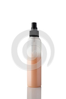 Spray bottle with colored liquid isolated on white background