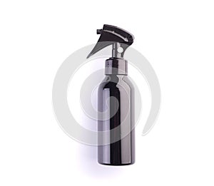 Spray bottle isolated on white background. Black plastic container for hair dressing or cosmetics