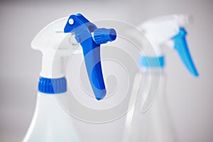 Spray, bottle and product for cleaning closeup in home or detergent in container for janitor service. Chemical, cleaner