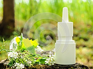 Spray bottle on a stump in the forest, alternative medicine concept photo