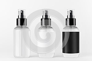 Spray bottles collection for cosmetics transparent and black, white blank labels on white background, mock up for branding.