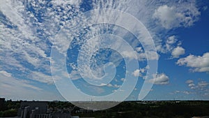 Spray of clouds against a backdrop of blue skies