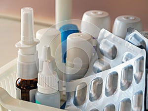 Spray, medicines in blisters and plastic containers close-up. Medical background for businesses