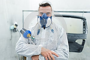 spray painter looking at camera