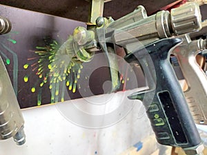 Spray pistoles for varnishing in a painters shop garage are ideal for automobile airbrushing with a compressor to repair cars