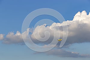 A spray plane in blue sky. Agricultural aviation