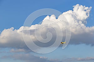 A spray plane in blue sky. Agricultural aviation