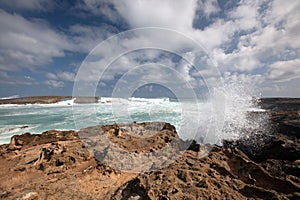 Spray from storm waves crashing into Laie Point coastline at Kaawa on the North Shore of Oahu Hawaii United States