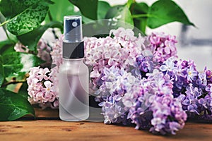 Sprayer bottle with lilac scent and blossom