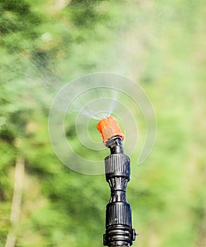 Spraying herbicide from the nozzle of the sprayer manual