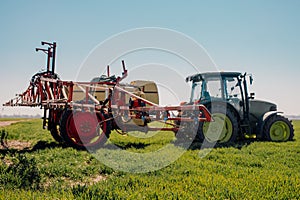 View of Tractor Ready to Spraying Herbicides. photo