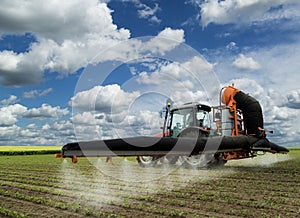 Spraying soybean field at spring