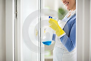 Spraying on window with cleanser