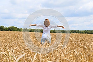 Spreadeagled woman in the gold field