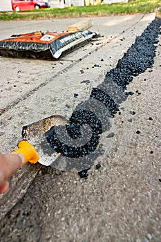 Spreading Asphalt On A Driveway