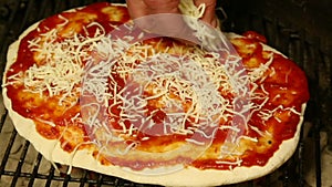 Spreading Cheese on Pizza