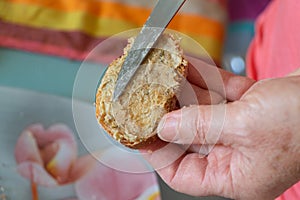 Spreading rillette on bread