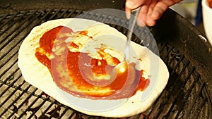 Spreading Tomato Sauce