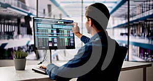 Spreadsheet Analyst Employee Using Computer Monitors photo