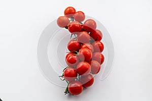 The sprig of red cherry tomatoes